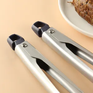 Stainless steel 11-inch food tongs for kitchen baking, bread, steak, and salad preparation.