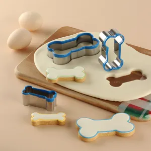 Stainless steel dog bone cookie cutter set with blue edge for DIY baking biscuits.