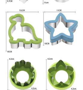 Stainless steel cartoon dinosaur and star fruit vegetable cutters with protective handles for cookie mold.