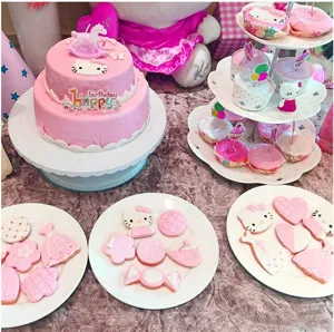 Pink Hello Kitty themed birthday cake, cute cupcakes and cookies party dessert table set