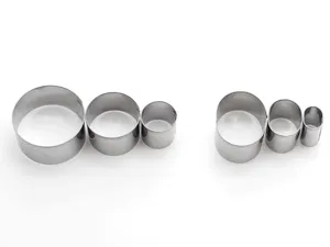 Stainless steel cookie cutters detail view, round and oval baking molds for DIY pastry making.