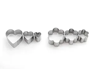 Stainless steel baking mold detail view showing heart and flower cookie cutter sizes clearly.