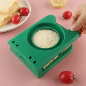 Green plastic sandwich cutter and sealer mold with hand guard for DIY toast baking breakfast