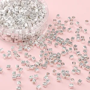 Silver plated square spacer beads detail view for DIY handmade jewelry crafting and bracelets.