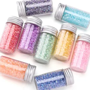 Faceted glass beads in small bottles, colorful loose beads for DIY jewelry making detail.