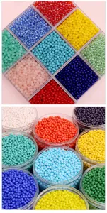 Colorful glass seed beads for DIY jewelry craft. Detailed close-up view of vibrant beads.