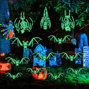 Halloween glow-in-the-dark bat and skeleton scene detail showcasing spooky outdoor night decor.