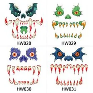 Monster face temporary tattoo detail showing scary eyes and bloody teeth design set.