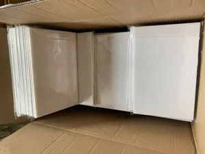 Acrylic mirror wall sticker sheets bulk packed in box for bedroom and living room decor.