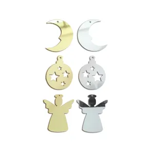 Gold and silver mirror acrylic Christmas decor detail, angel and moon shape hanging pieces.