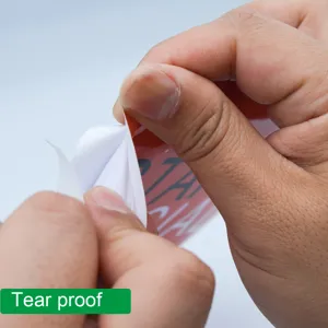 Tear proof sticker detail showing extreme durability and strong tear resistance.
