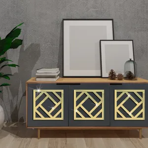 Detail view of 3d geometric acrylic mirror wall sticker, modern gold decor for cabinet furniture.