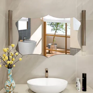 Decorative irregular wall mirror detail in modern bathroom scene with warm tiles and lighting.