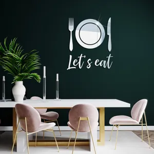Detailed view of modern acrylic mirror wall sticker with cutlery and let's eat lettering.