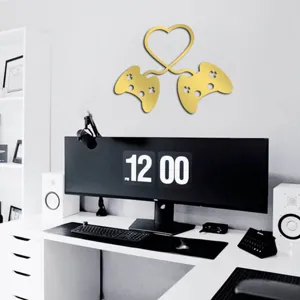 Detail view of gold acrylic gaming controller heart mirror wall sticker for bedroom decor.