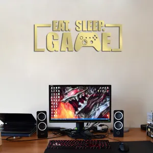 Gold acrylic mirror wall sticker featuring eat sleep game quote and controller design for room decor.