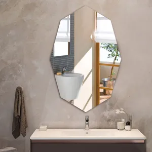 Detailed view of the modern polygonal bathroom wall mirror showing reflection and decor.