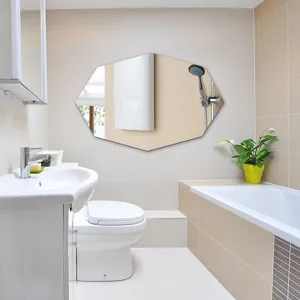 Modern minimalist hexagonal mirror wall sticker detail in a clean bathroom setting.