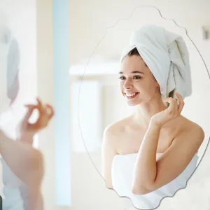 Detailed view of scalloped oval decorative mirror sticker, perfect for bathroom wall decor.