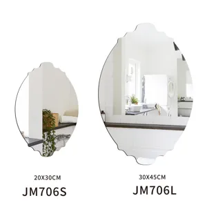 Decorative frameless oval wall mirror detail view showing size variations for bathroom.