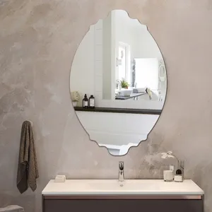 Detailed view of the decorative scalloped wall mirror showcasing its unique elegant curved edge.