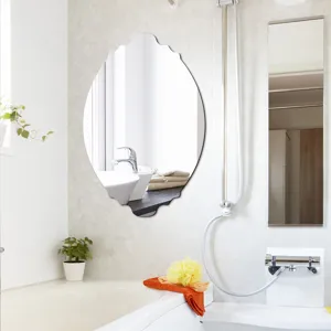 Bathroom decorative wall mirror detail showing the unique wavy oval shape and clean reflection.