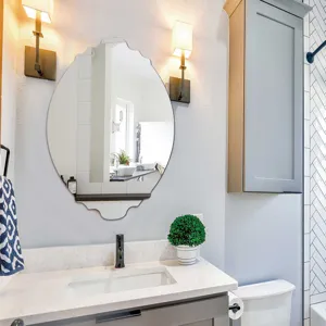 Scalloped oval wall mirror detail in modern bathroom decor, elegant wall hanging design for home