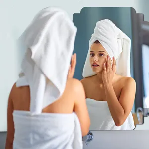 Acrylic decorative wall mirror sticker for bathroom and bedroom, clear reflection design.