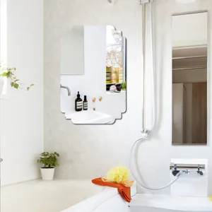 Detail view of a modern decorative wall mirror in a sleek bathroom setup, elegant design.