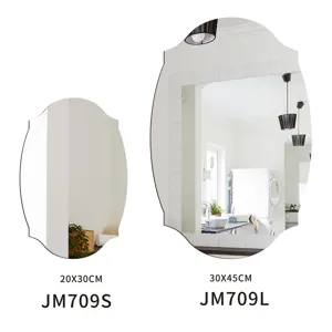 Decorative irregular wall mirror detail showing different sizes and reflective surface design.