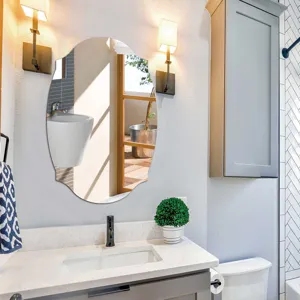 Modern scalloped oval wall mirror for bathroom decoration, elegant product detail view.