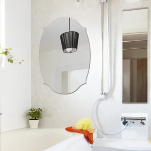 Bathroom detail view showing an elegant oval wall decorative mirror mounted on the wall.