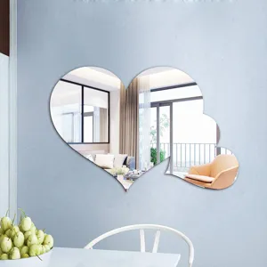 Detailed view of creative heart shaped acrylic wall mirror sticker for home decoration.