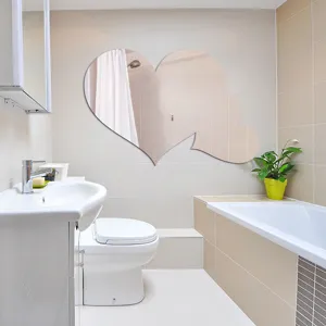 Modern heart shaped acrylic wall mirror sticker for bathroom decor in home design.