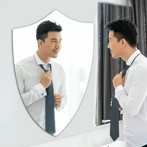 Decorative shield shaped wall mirror acrylic mirror sticker for bathroom and home decor.