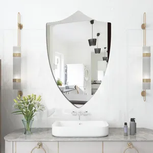 Decorative shield shaped wall mirror for bathroom, elegant modern design for home decor detail.