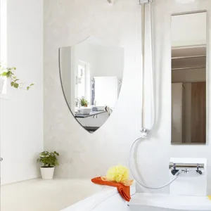 Shield shaped wall mirror detail shot, perfect for bathroom decor and modern home interior styles.