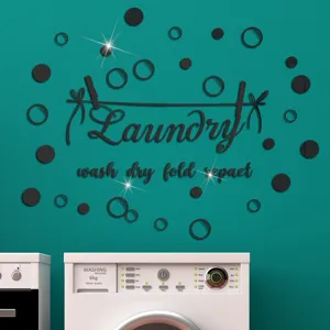 Close-up view of the black acrylic laundry wall sticker with bubbles in a modern laundry room.