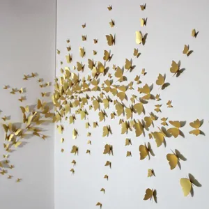 Detailed closeup of 3D gold paper butterfly wall stickers for stunning home decoration.