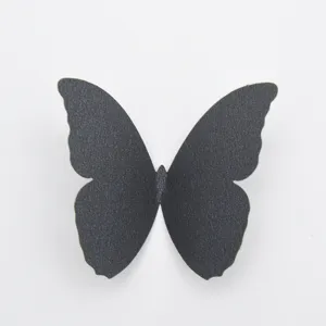 Black 3D pearlescent paper butterfly wall sticker for home decor DIY creative background.