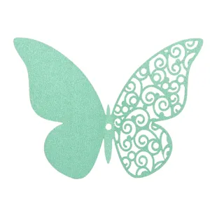 Mint green pearlescent paper butterfly cutout detail, beautiful hollow swirl pattern craft.
