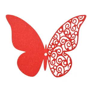 Close-up detail of red hollow paper butterfly wall sticker with delicate filigree scrollwork.