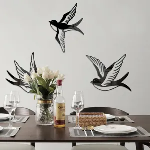 Acrylic mirror bird wall stickers detail showing swallow design mounted on dining room wall.
