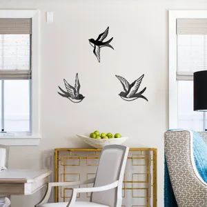 Acrylic swallow wall mirror stickers displayed on living room wall, modern home decor detail.