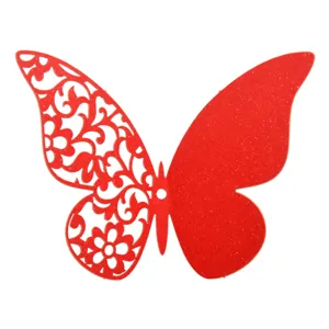 Close-up detail of red 3D hollow paper butterfly wall sticker with glitter wing design.