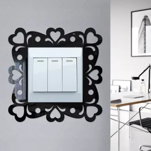 Acrylic mirror light switch sticker with heart hollow design, stylish wall decor for room.