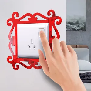 Acrylic mirror switch sticker detail showing the decorative red frame mounted on wall with light switch.