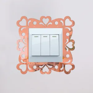 Acrylic mirror switch sticker detail showing rose gold decorative heart frame on wall switch.