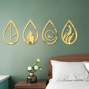 Acrylic mirror wall sticker detail view showing four elements design on a modern green bedroom wall.