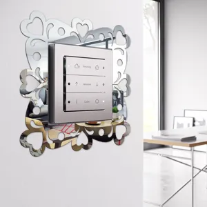 Acrylic mirror switch wall sticker with heart hollow design for modern home room decor.
